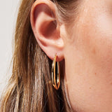 Cuidado Hoop Earrings in Gold